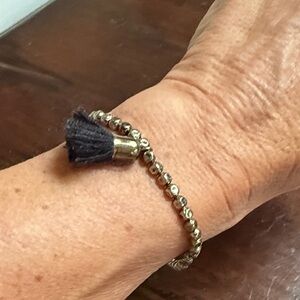 Elegant Gold Beaded Bracelet with Black Tassel